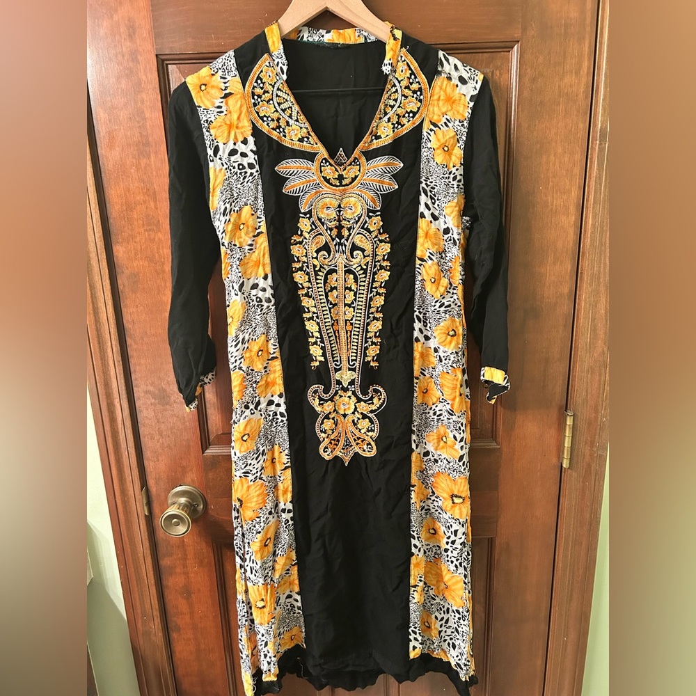 Embroidered Black and Yellow Kurta. There are small tears on shoulder and side